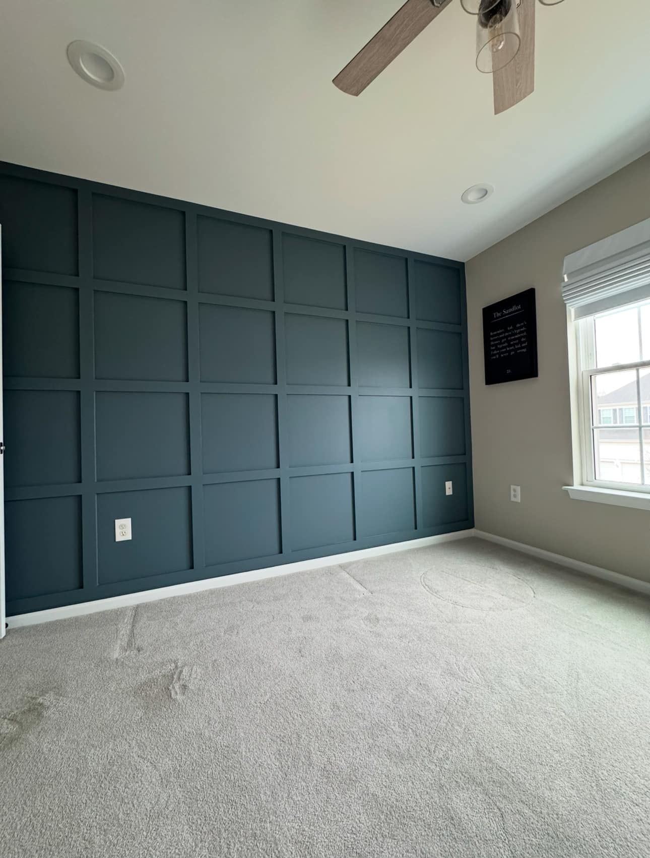 A living room with a couch , table and chairs.