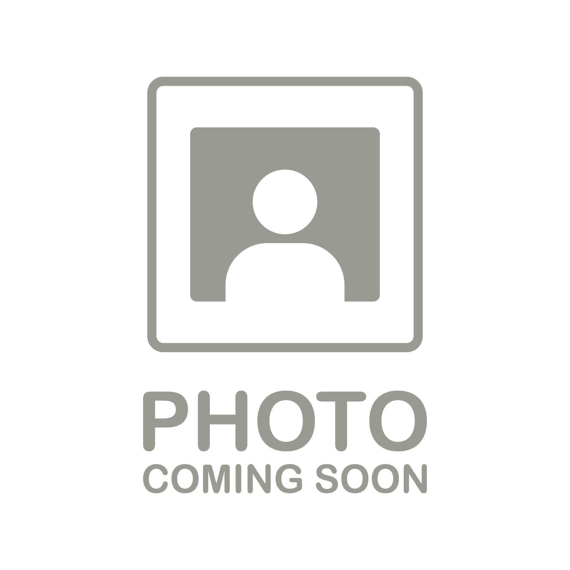 Woman with light brown hair, smiling, wearing a lavender floral shirt and a silver pendant necklace, against a cream wall.