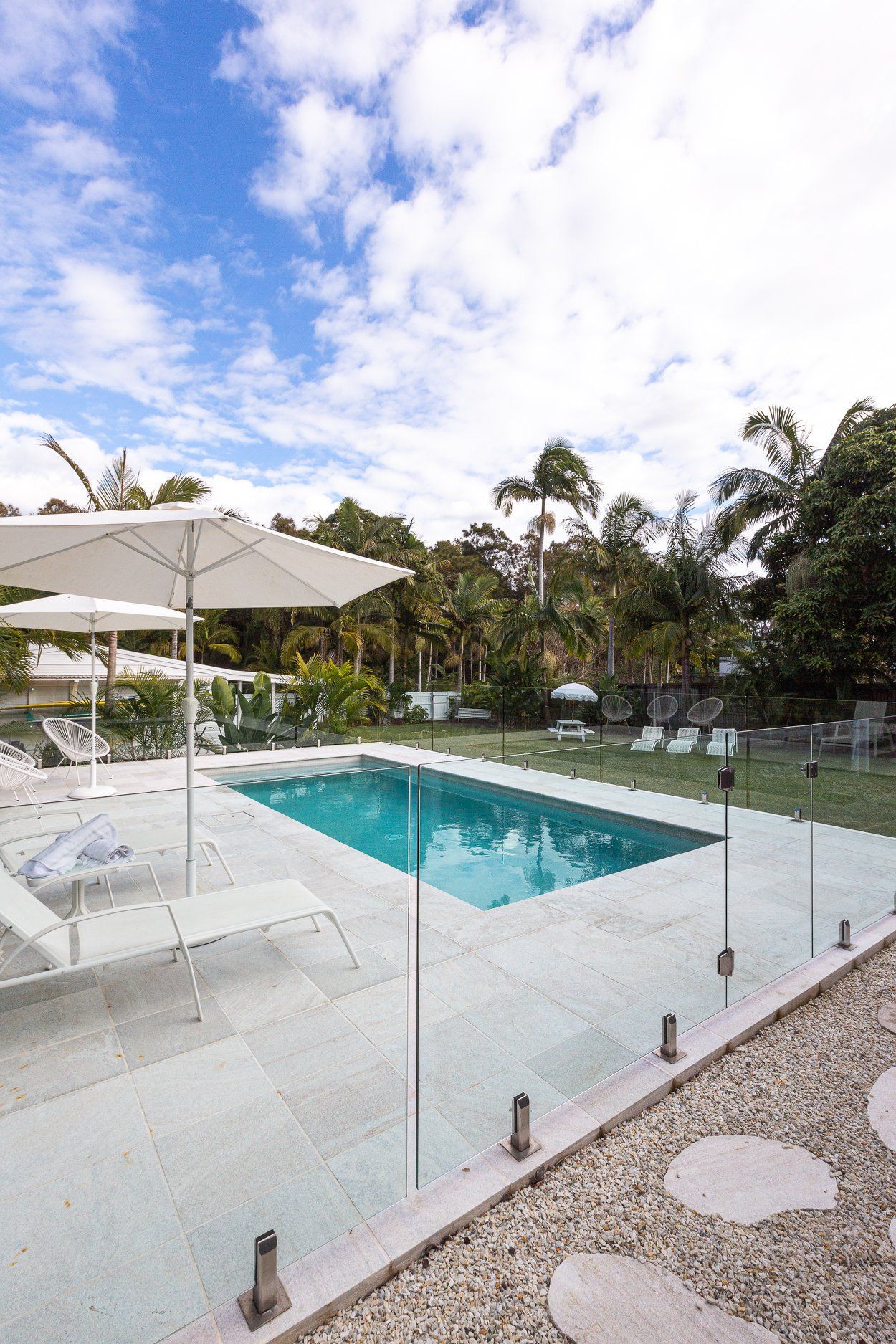 Swimming Pool With Artificial Metal Waterfall — Profile Pools & Landscaping In Tweed Heads, NSW