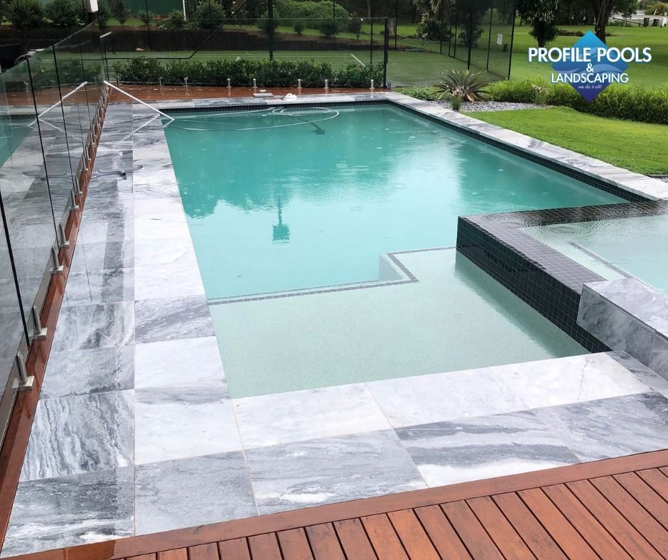 New Swimming Pool Being Installed In A Back Yard — Profile Pools & Landscaping In Lismore, NSW