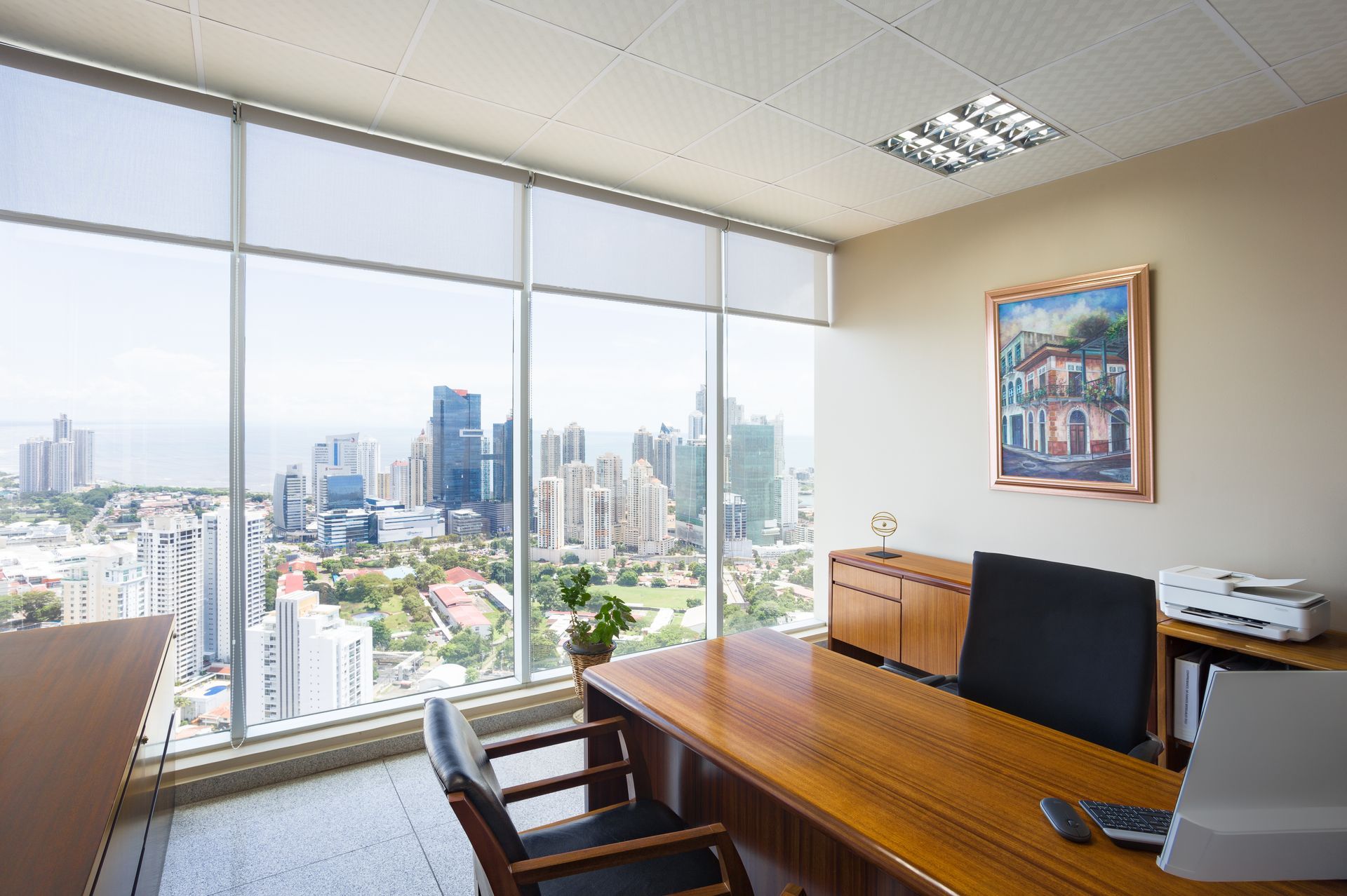 Office with big window overlooking a city