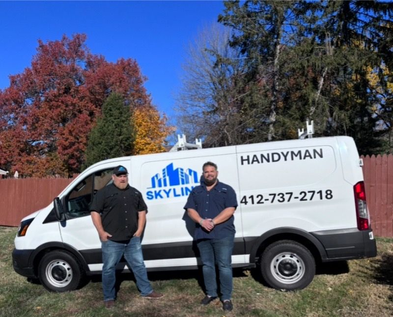 Person with tool bags walking towards a house with a yellow door.