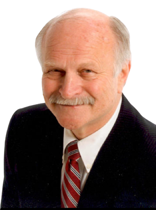 A bald man with a mustache wearing a suit and tie