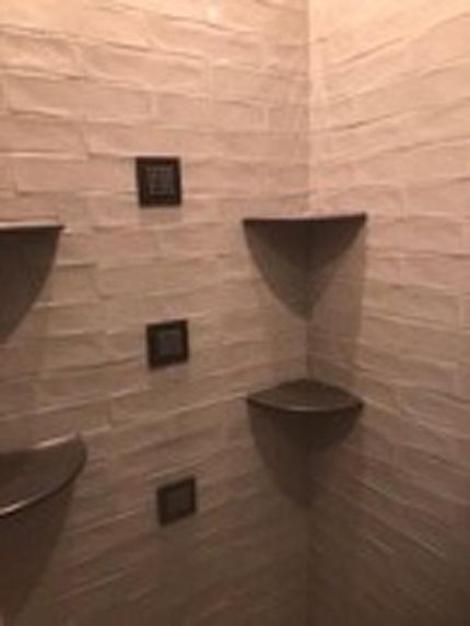 Custom tiled shower with built-in shelves, completed by DMF Construction in Scotch Plains, NJ.