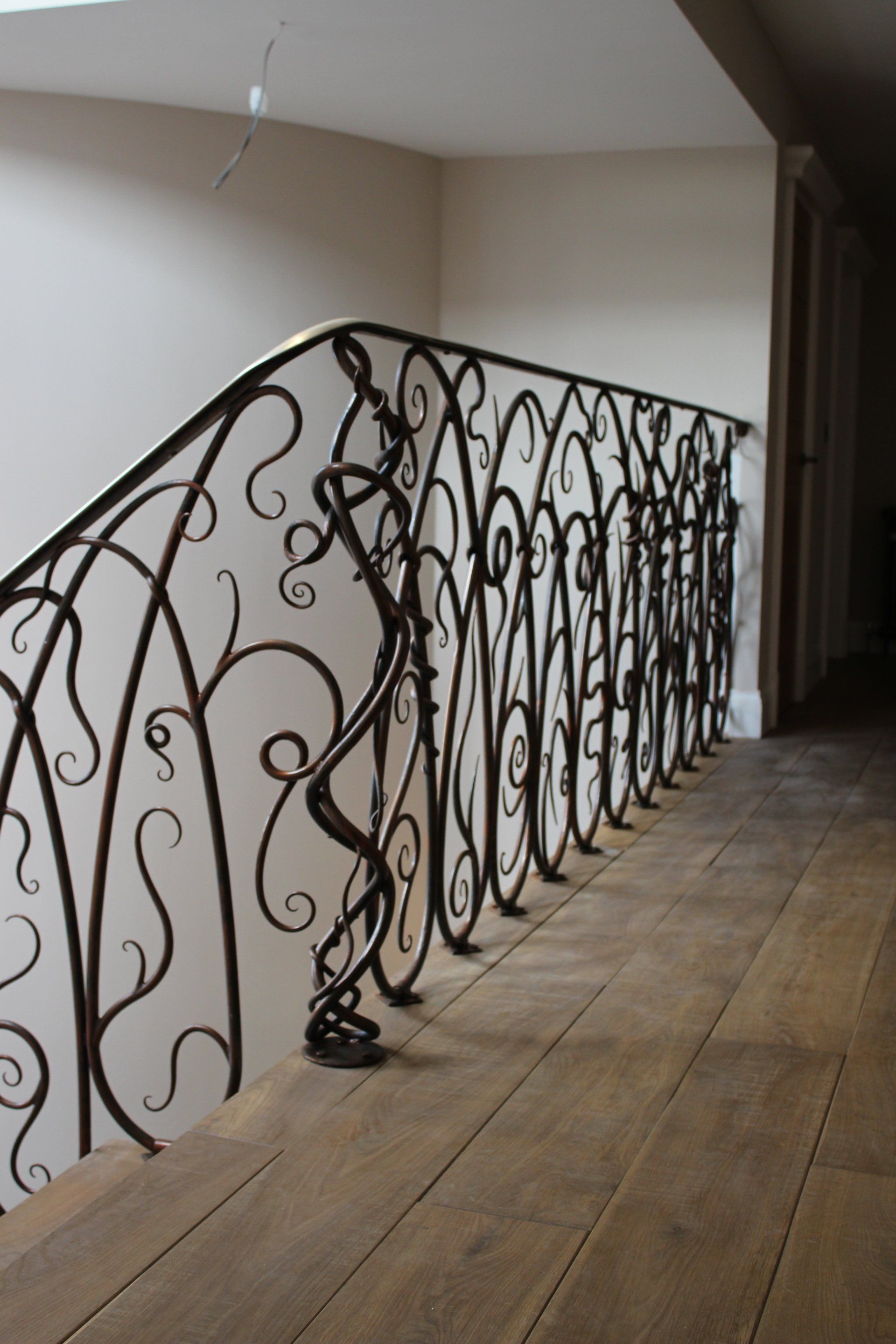 one of a kind staircase by  award winning blacksmith William Holland