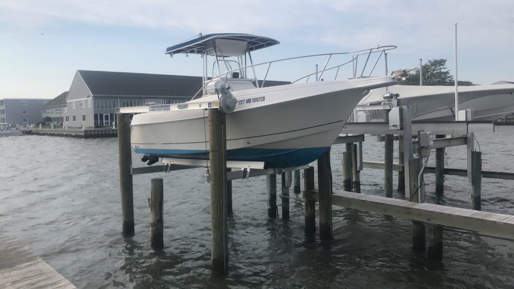 A boat is docked at a dock in the water.