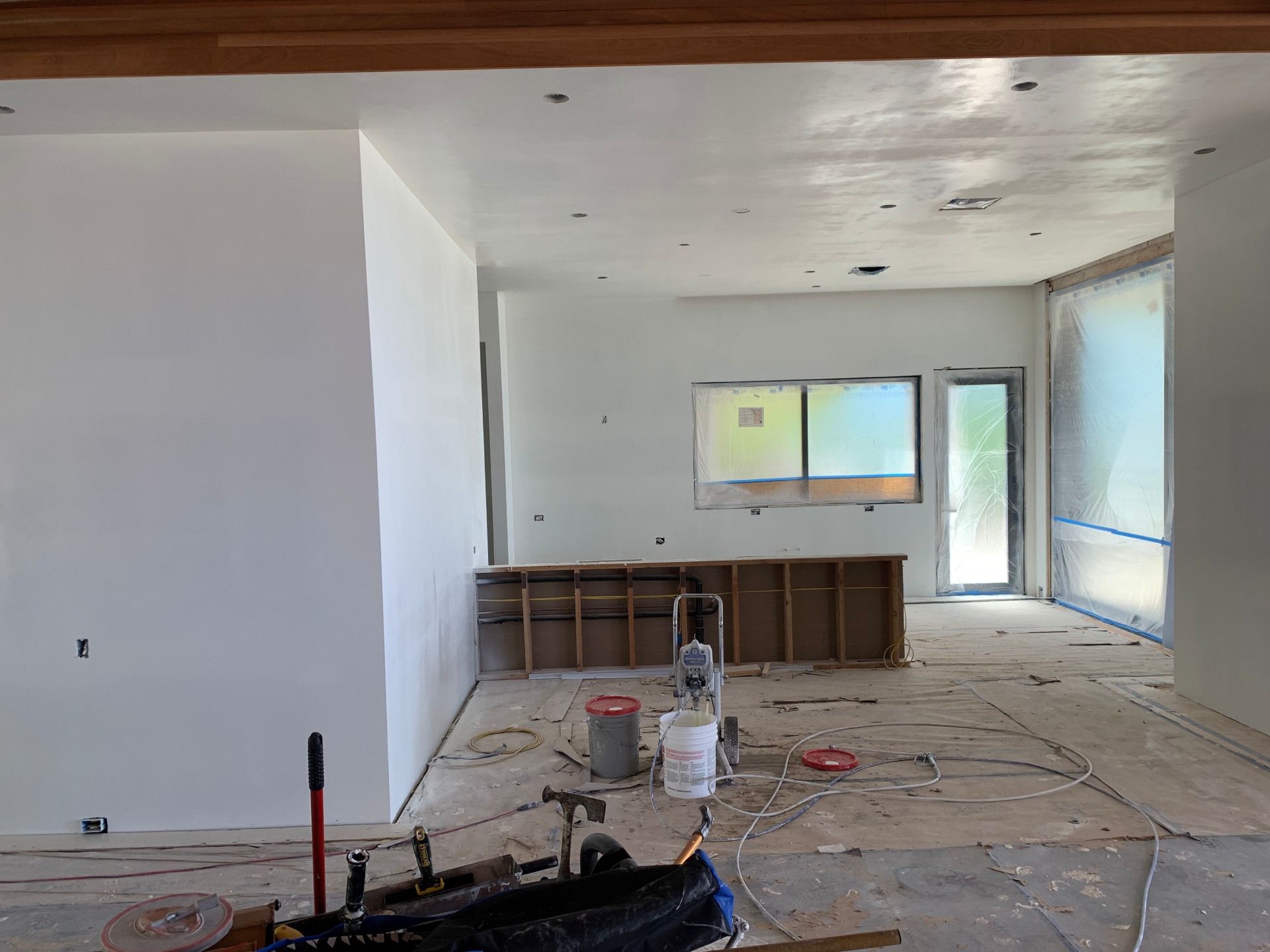 A room that is being remodeled with a lot of tools on the floor.