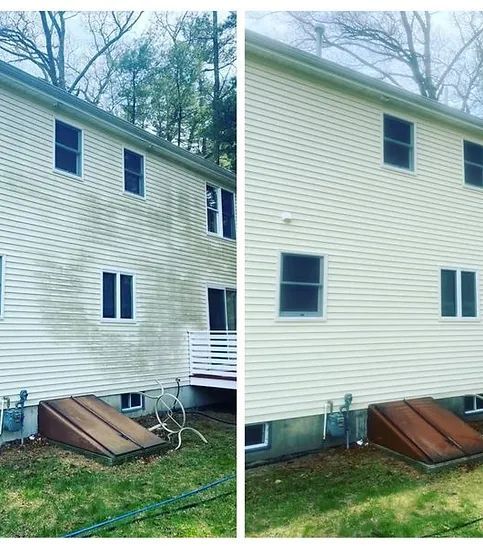 Side-by-side comparison of a house exterior. Before (dirty) and after (cleaned) sections of siding are visible.