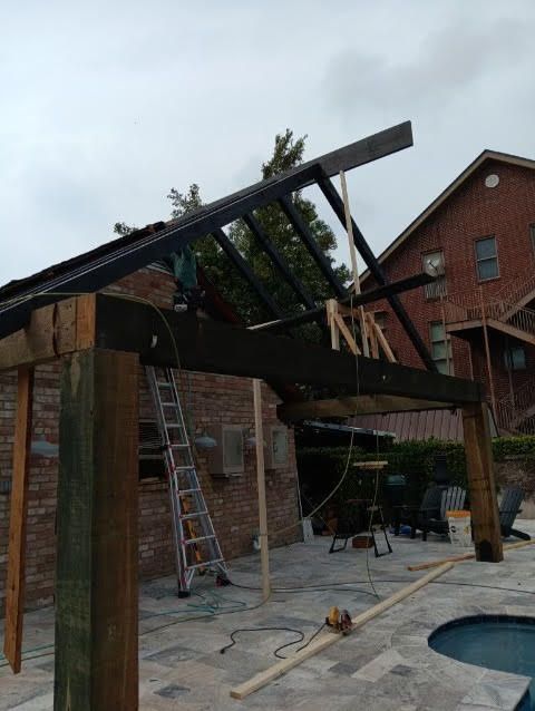 A swimming pool is being remodeled in a backyard.