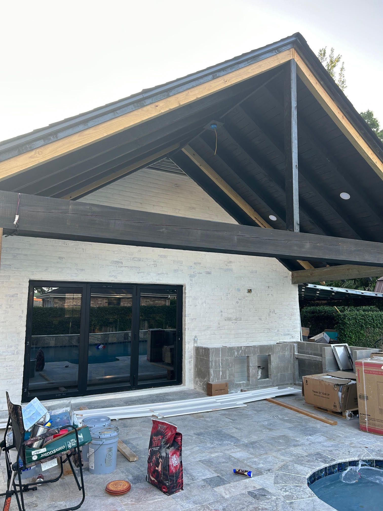 A large swimming pool with a fence in the background