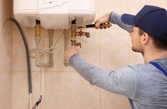 Employee fixing a boiler