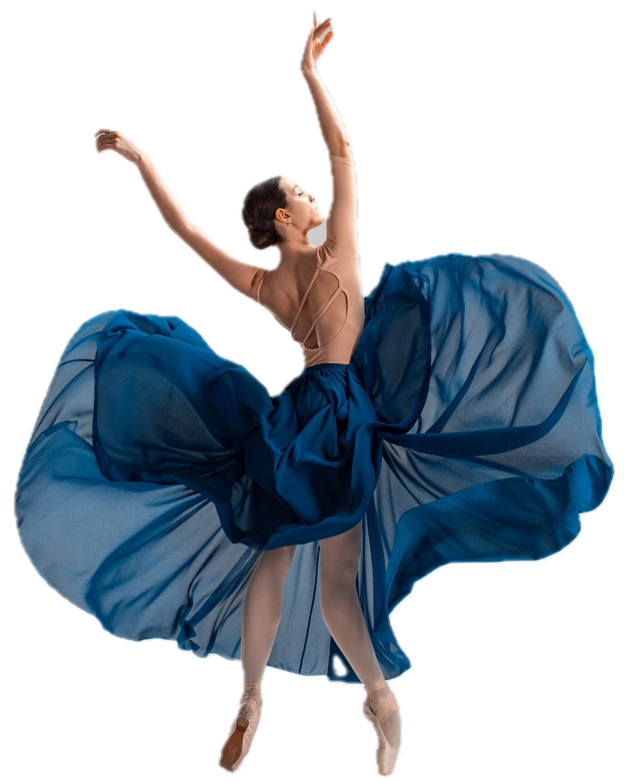 Ballerina in a blue dress, mid-leap with arms raised, fabric billowing around her like wings against a white background.