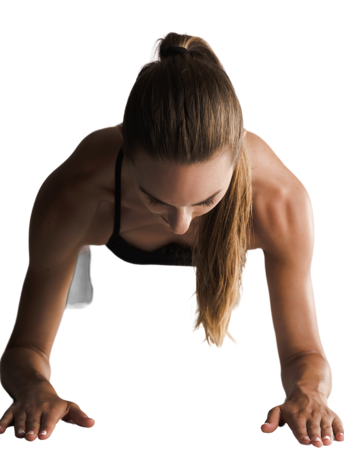 Woman in plank position, wearing black athletic attire. She is looking down, with arms straight, resting on her forearms.
