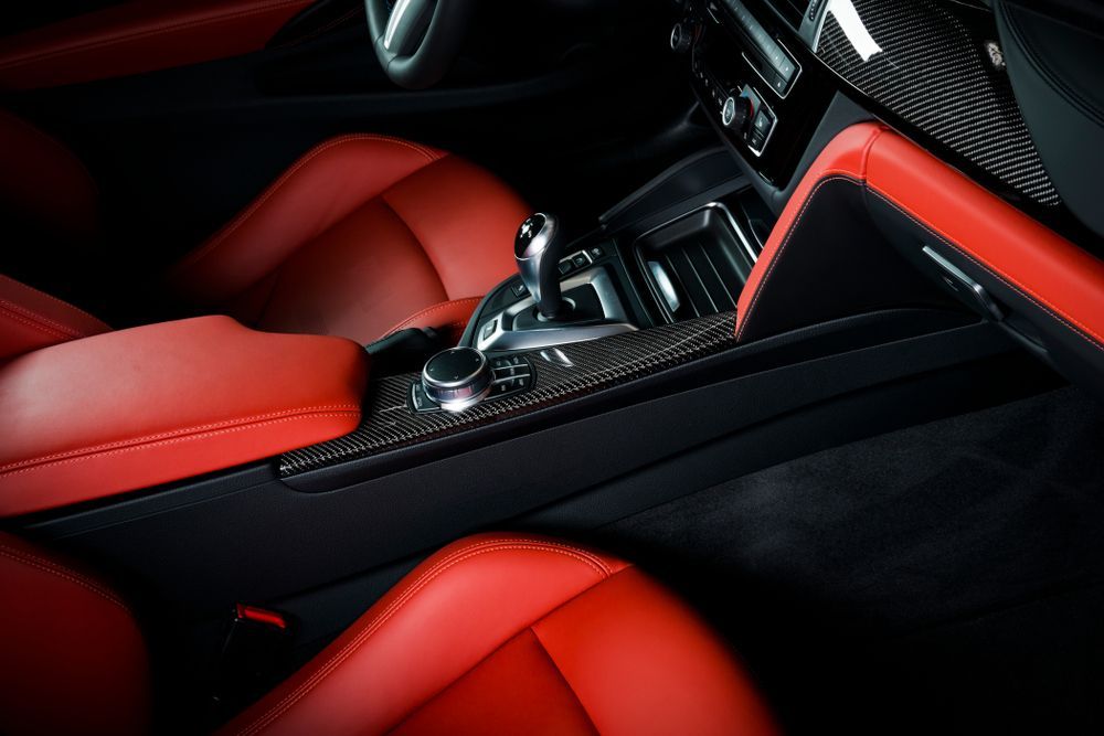 Red Leather Car Interior With Black Accents, Gearshift, and Carbon Fibre Trim — TrueGloss Elite Coatings In Wyong, NSW