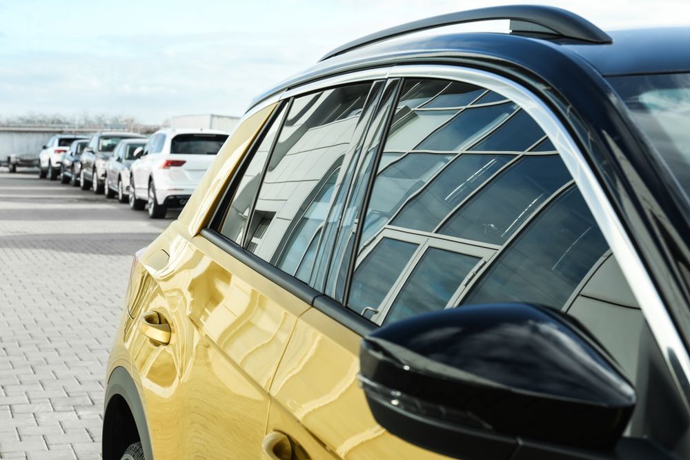 Yellow Car Parked, Reflections of a Building in the Window — TrueGloss Elite Coatings In Central Coast, NSW