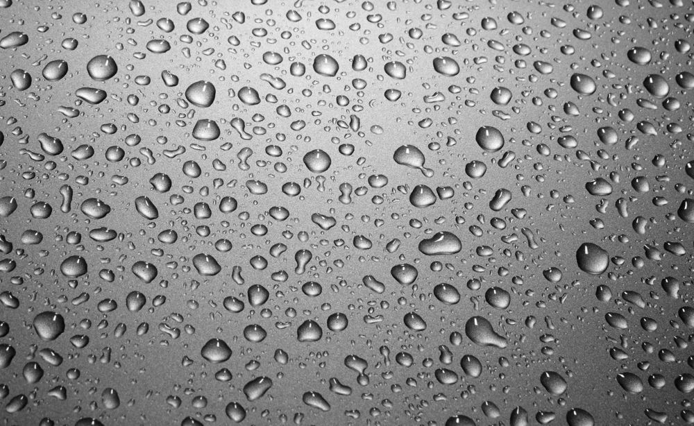 Water Droplets on a Shiny, Reflective Silver Surface — TrueGloss Elite Coatings In Wyong, NSW
