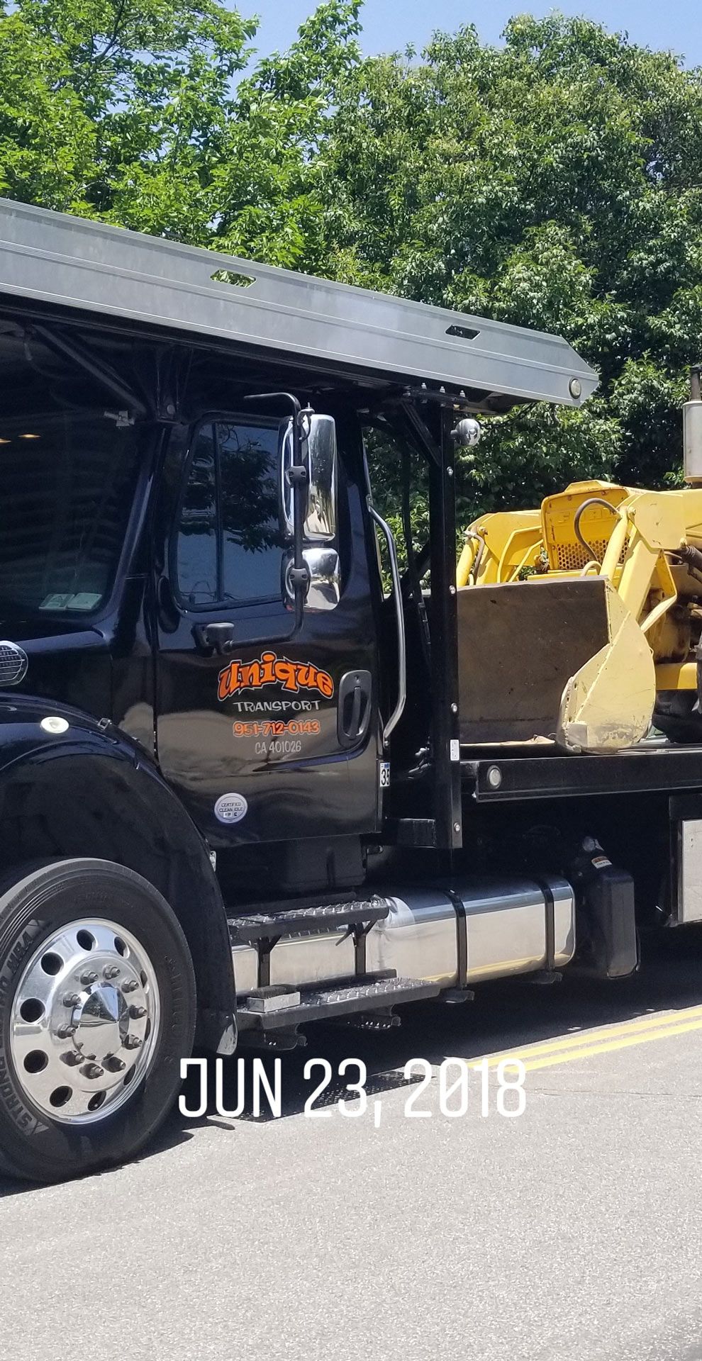Construction Truck On Tow Truck | Riverside, CA | Unique Auto Transport
