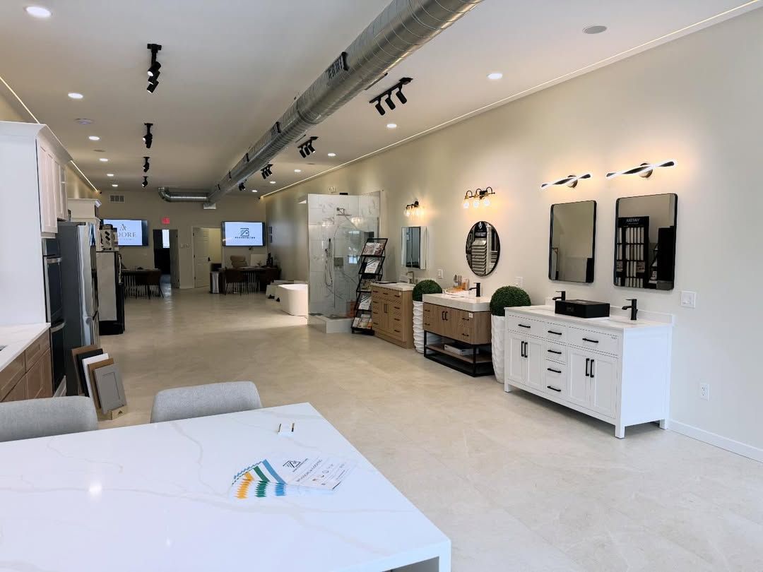 Bathroom and kitchen showroom with various vanities, sinks, and lighting fixtures.