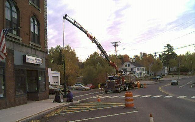 Knuckle Boom Setting Light Poles in Winter Harbor, ME