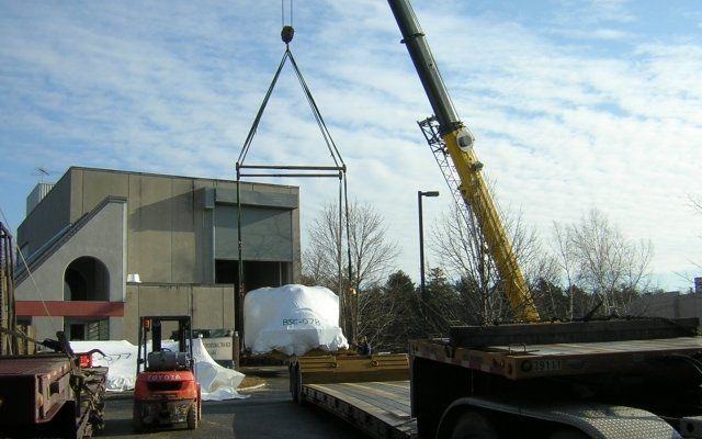 Crane Service Technicians Loading Airplane Simulator
