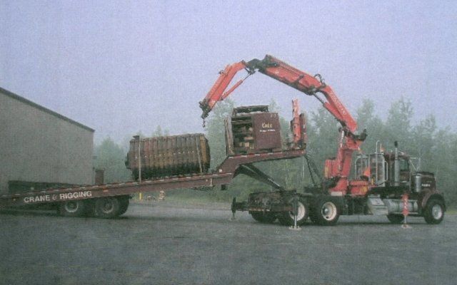 Boiler Sections Being Rolled Off Rear Landoll Haul-All