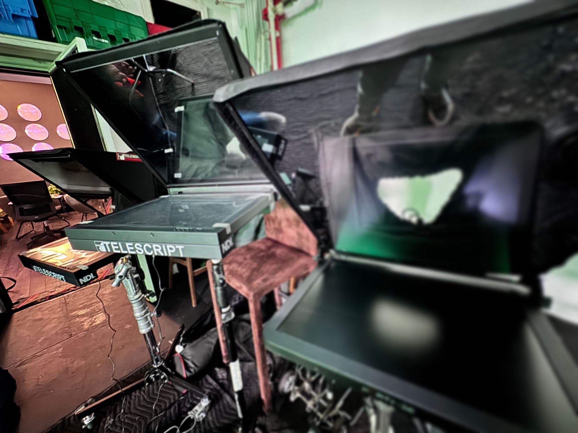 Three through the lens teleprompters
