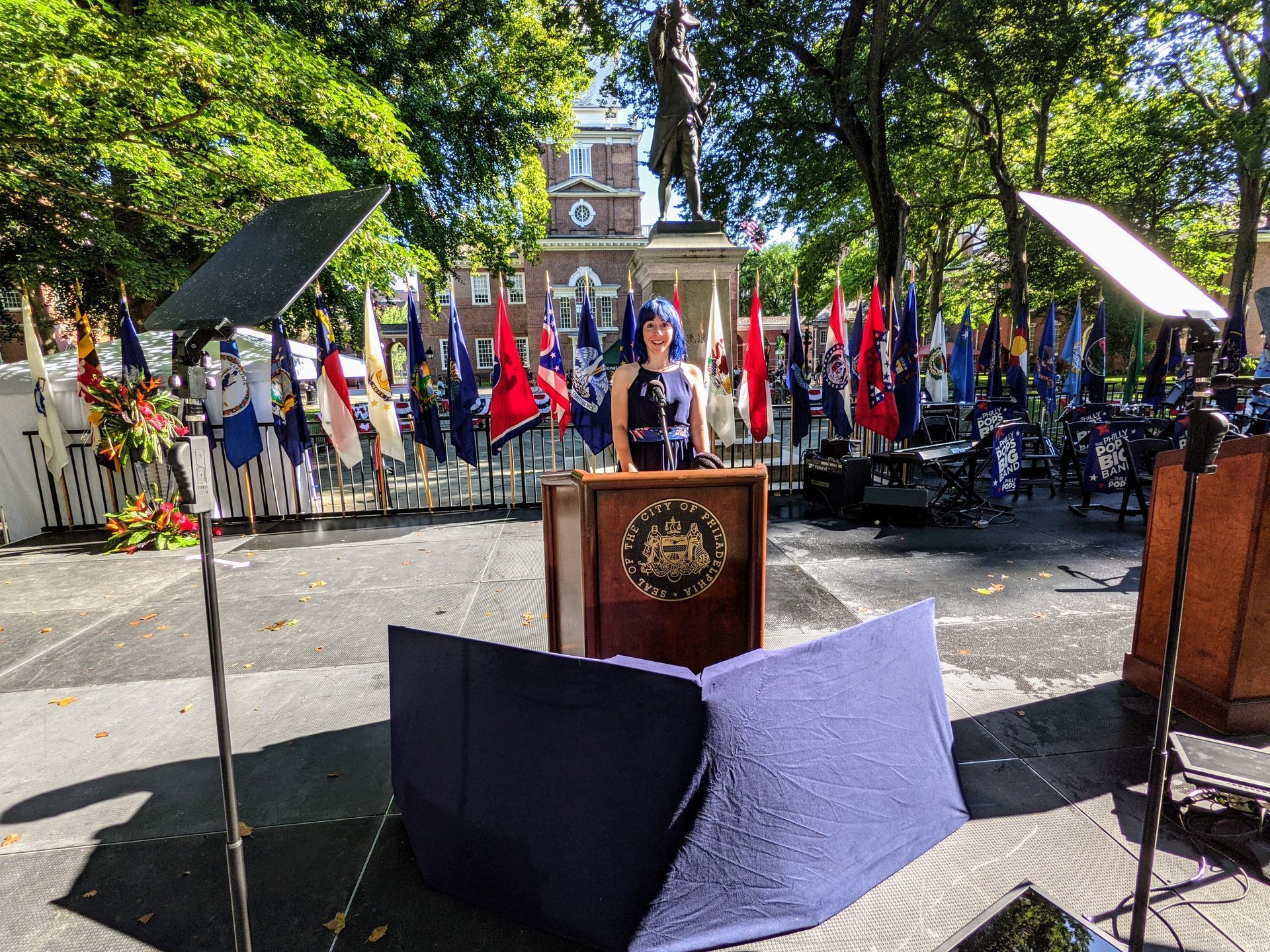 Presidential Prompter Vanessa stands before a prompter