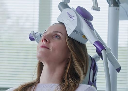Woman having TMS Therapy