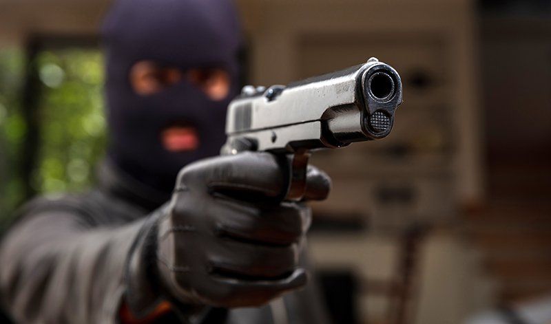 Robber with gun