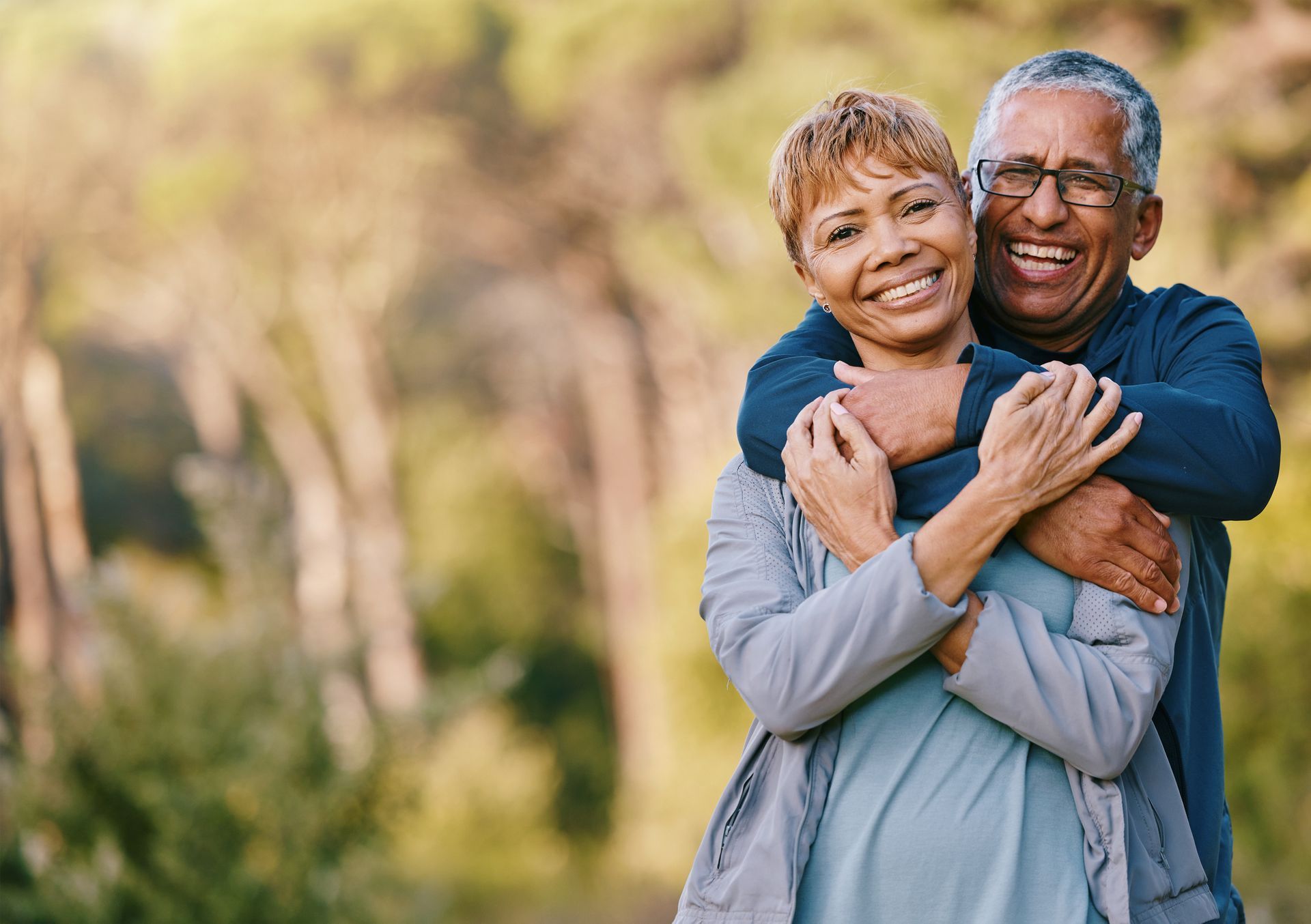 elderly couple hugging