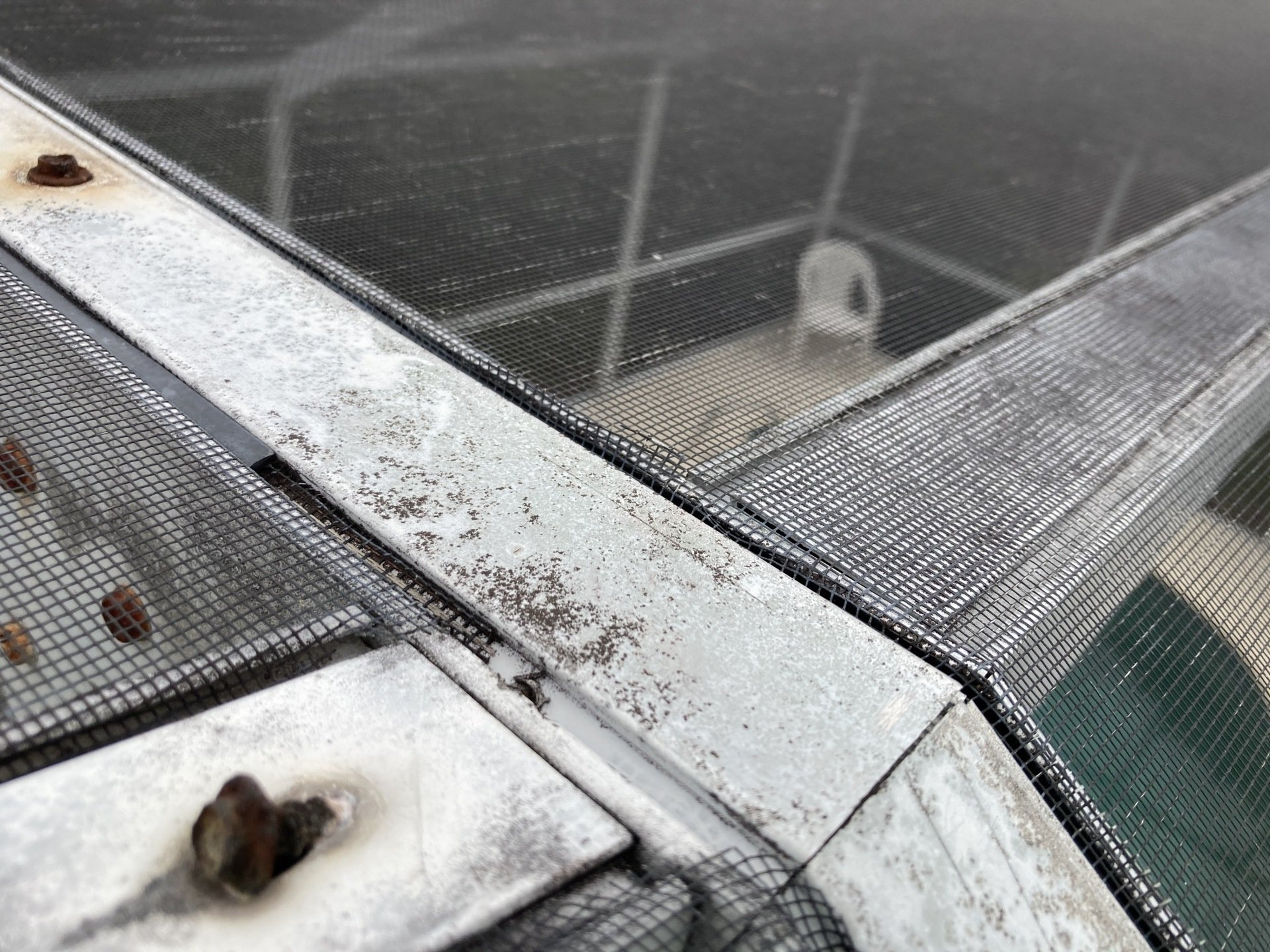 A close up of a metal structure with a screen on it.