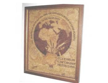 A picture of a globe in a wooden frame