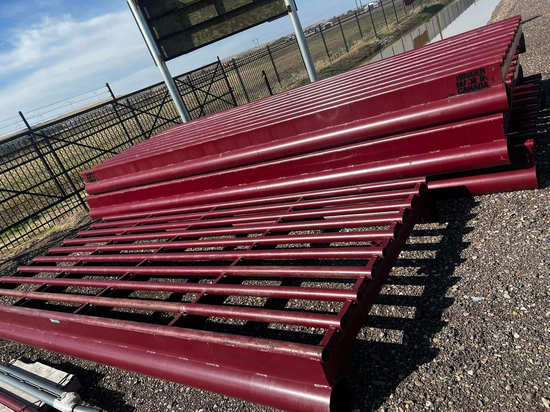 A bunch of red pipes are stacked on top of each other