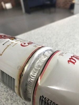 Two Aluminum Soda Cans Welded Together at the Seams — R&M Sheetmetal Nowra Metal Roofing in South Nowra, NSW