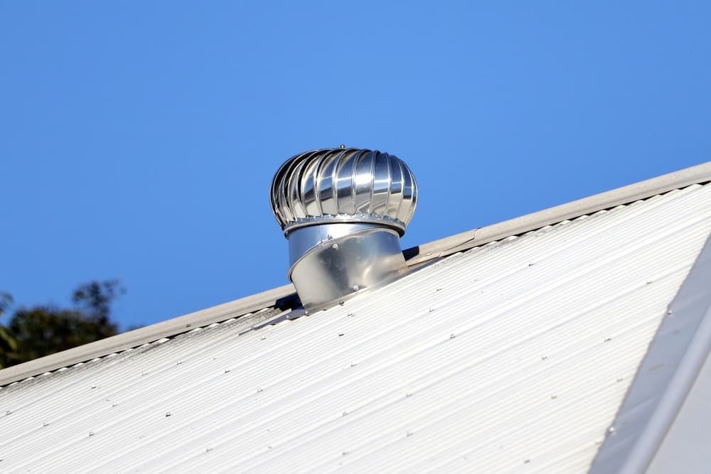 A White Roof with A Wind Turbine on Top of It — R&M Sheetmetal Nowra Metal Roofing in Berry, NSW