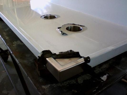 White Countertop With Two Faucet Holes and a Damaged Corner — R&M Sheetmetal Nowra Metal Roofing in South Nowra, NSW