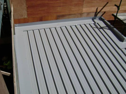 Gray Corrugated Metal Roof With Wooden Backing — R&M Sheetmetal Nowra Metal Roofing in South Nowra, NSW