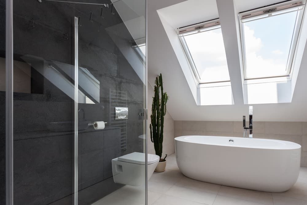 A Bathroom with A Bathtub, Toilet and Skylights — R&M Sheetmetal Nowra Metal Roofing in Vincentia, NSW