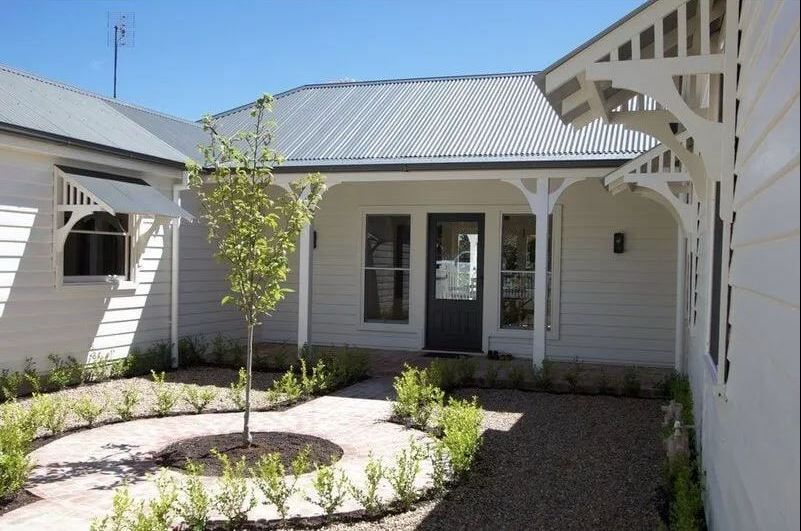 A White House with A Tree in Front of It — R&M Sheetmetal Nowra Metal Roofing in South Nowra, NSW