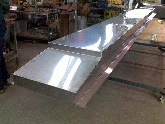 A Long, Stainless Steel Bar Counter in a Workshop. It is Elevated in Two Tiers — R&M Sheetmetal Nowra Metal Roofing in South Nowra, NSW