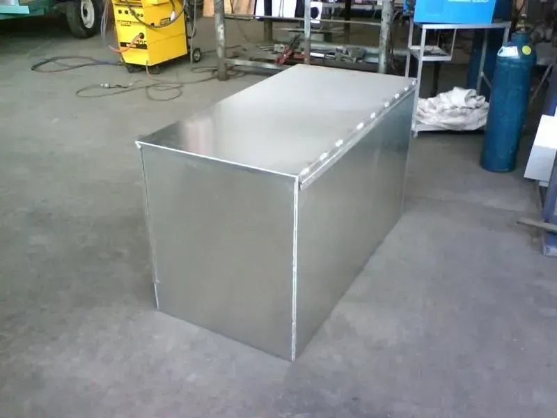 A Large Aluminum Box Is Sitting on A Concrete Floor — R&M Sheetmetal Nowra Metal Roofing in South Nowra, NSW