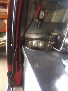A Stainless Steel Sink Is Sitting on A Counter in A Kitchen — R&M Sheetmetal Nowra Metal Roofing in South Nowra, NSW