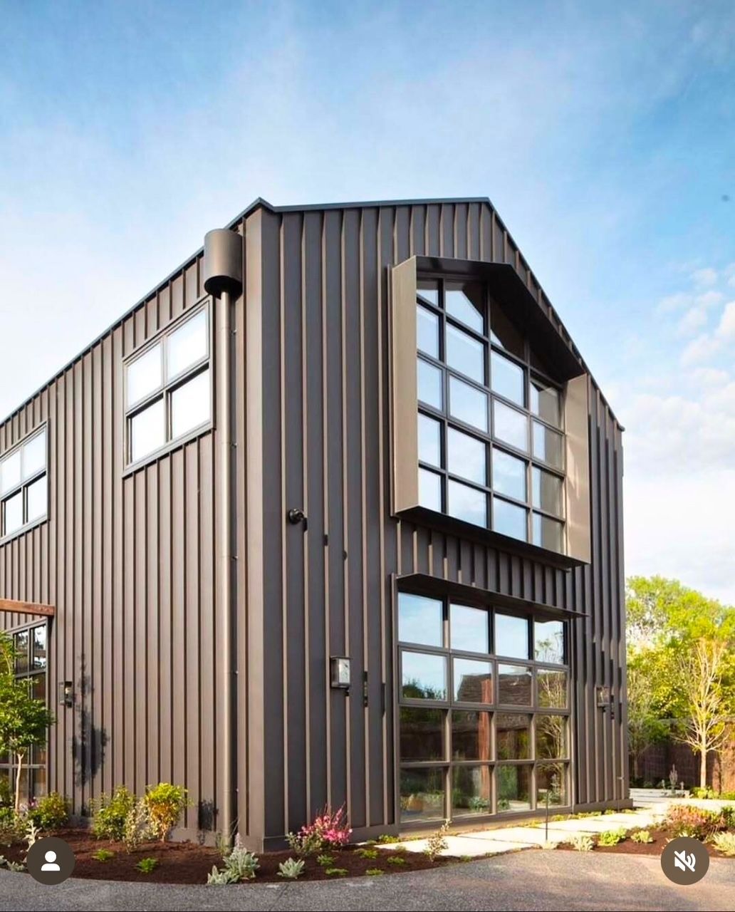 A large brown building with a lot of windows — R&M Sheetmetal Nowra Metal Roofing in Sussex, NSW