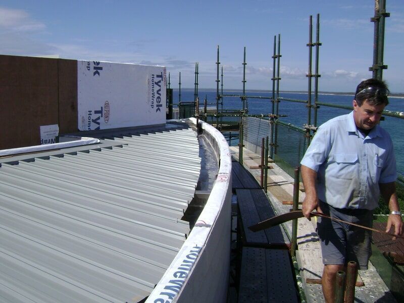 A Man Standing on Top — R&M Sheetmetal Nowra Metal Roofing in South Nowra, NSW