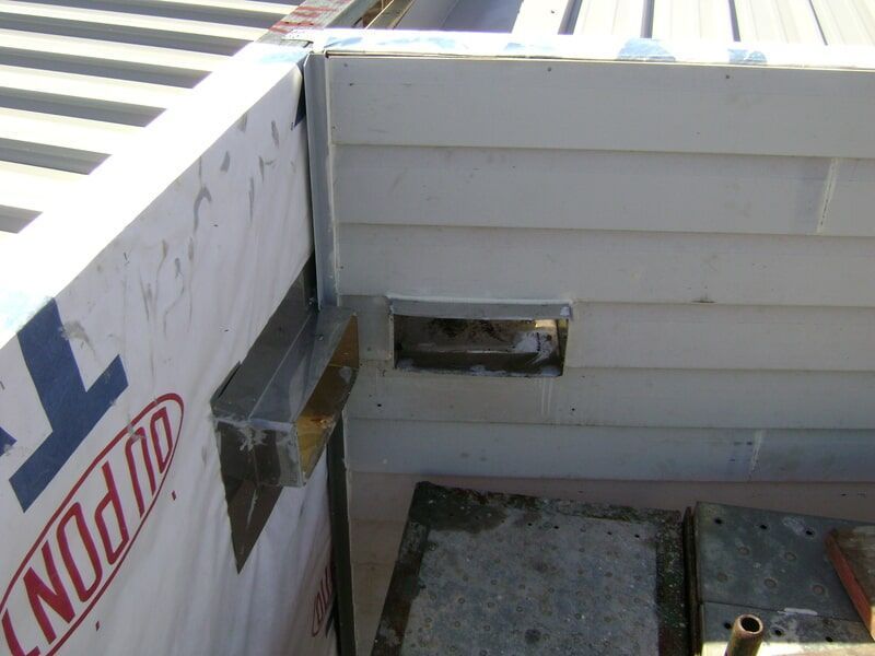 A White Wall with The Word Dupont on It — R&M Sheetmetal Nowra Metal Roofing in South Nowra, NSW