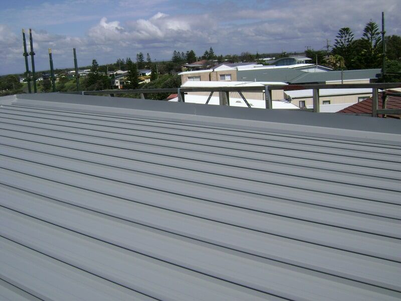 The Roof of A Building with A View of The City — R&M Sheetmetal Nowra Metal Roofing in South Nowra, NSW