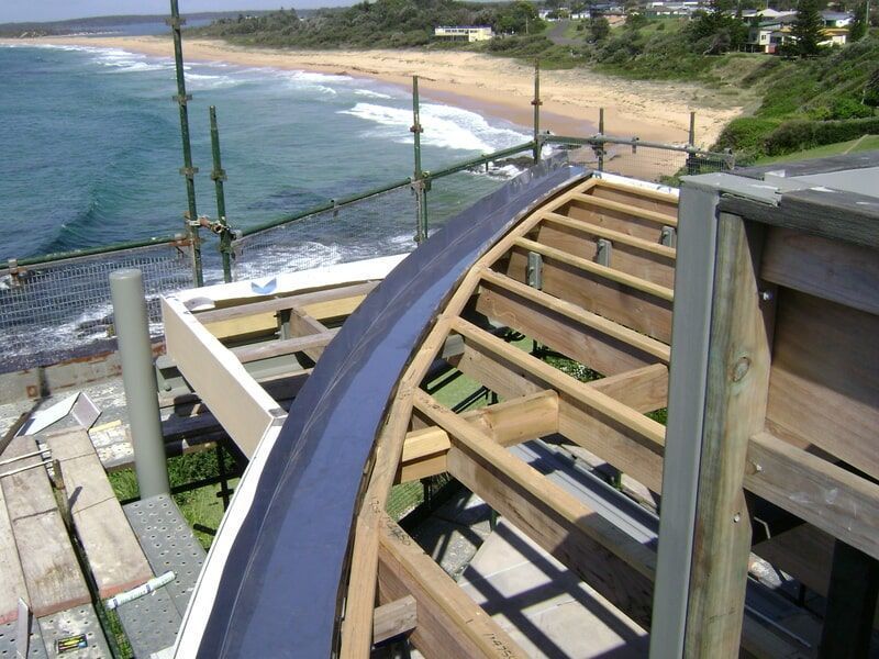 A Building Under Construction with A View of The Ocean — R&M Sheetmetal Nowra Metal Roofing in South Nowra, NSW