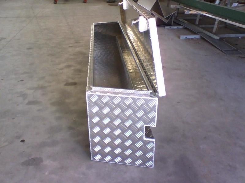 A Metal Box with The Lid Open Is Sitting on A Concrete Floor — R&M Sheetmetal Nowra Metal Roofing in South Nowra, NSW