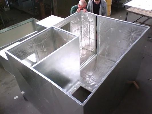 Two People Inspecting an Insulated Metal Enclosure — R&M Sheetmetal Nowra Metal Roofing in South Nowra, NSW