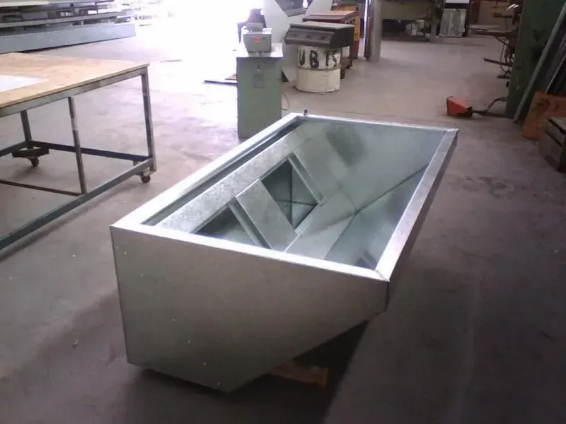 A Large Metal Container Is Sitting on The Floor in A Room — R&M Sheetmetal Nowra Metal Roofing in South Nowra, NSW